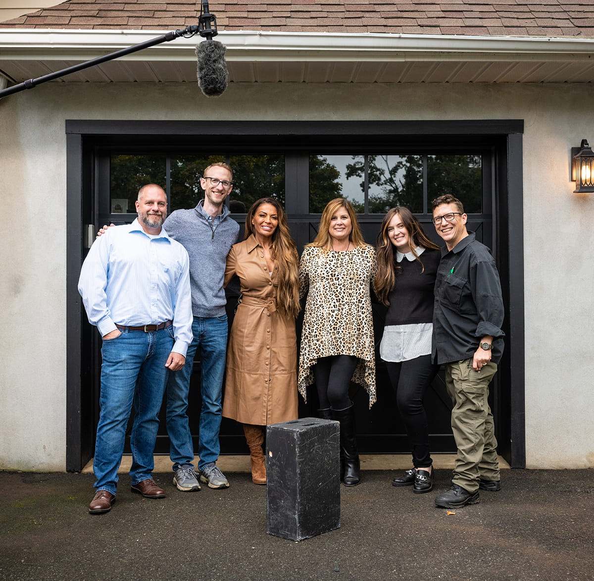 Garage door installers in New Jersey with homeowner after installation